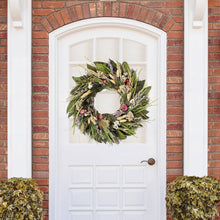 Load image into Gallery viewer, Prairie wreath with dried flowers and greenery hanging on white door with brick archway