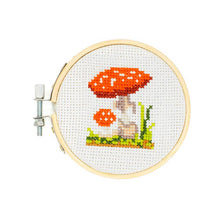 Load image into Gallery viewer, Cross stitch embroidery hoop with completed red and white mushroom design on white fabric