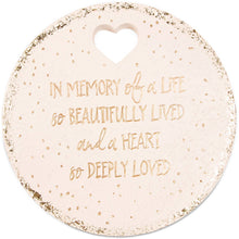 Load image into Gallery viewer, Round pink memorial garden stone with gold text reading 'In Memory of a Life so Beautifully Lived and a Heart so Deeply Lo...