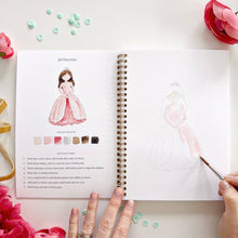 Load image into Gallery viewer, Open fairytale watercolor workbook showing princess painting tutorial with color palette and instructions