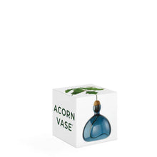 Load image into Gallery viewer, Blue glass acorn-shaped vase with green plant stem in white gift box