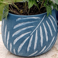 Load image into Gallery viewer, Blue ceramic planter with white leaf pattern containing green leafy plants