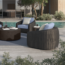 Load image into Gallery viewer, Dark wicker Boulevard Club Swivel Glider chairs with blue cushions beside a pool