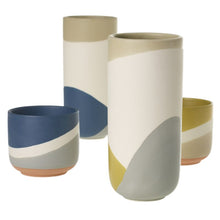 Load image into Gallery viewer, Collection of modern ceramic planters with geometric color block patterns in blue, yellow, gray and neutral tones