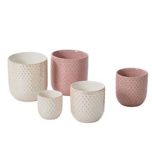 Load image into Gallery viewer, Set of five ceramic planters in white and pink with textured dimpled surfaces