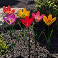 Load image into Gallery viewer, Colorful metal flower garden stakes in purple, yellow, red, pink, and orange blooming in soil