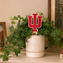 Load image into Gallery viewer, Red Indiana University trident logo plant stake displayed in white ceramic planter with trailing ivy