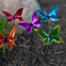 Load image into Gallery viewer, Colorful metal butterfly garden stakes in red, purple, blue, orange and green displayed outdoors