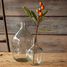 Load image into Gallery viewer, Artificial loquat stem with orange berries and green leaves displayed in a clear glass vase