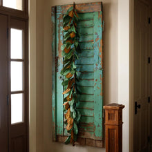Load image into Gallery viewer, Rustic magnolia leaf garland draped over a distressed turquoise shutter wall decor