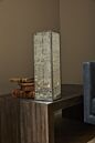 Load image into Gallery viewer, Tall white decorative lantern with geometric cutout pattern on wooden surface