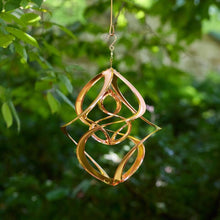 Load image into Gallery viewer, Copper-colored metal garden spinner with geometric double helix design hanging outdoors