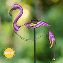 Load image into Gallery viewer, Purple flamingo garden stake with balancing design and weighted ball on green background