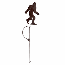 Load image into Gallery viewer, Dark brown metal Bigfoot silhouette garden stake with balance rocker design on long pole