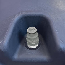 Load image into Gallery viewer, White plastic screw cap drain fitting installed in blue molded drain basin