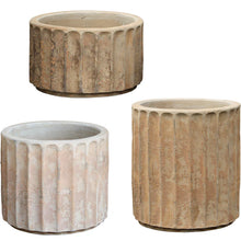 Load image into Gallery viewer, Set of three fluted concrete garden planters in varying heights with aged terracotta finish