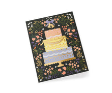 Load image into Gallery viewer, Congratulations greeting card featuring illustrated tiered wedding cake with floral border on black background
