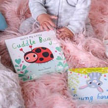Load image into Gallery viewer, Children's board book 'You're My Little Cuddle Bug' with red ladybug illustration on pink fuzzy blanket