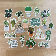 Load image into Gallery viewer, Collection of plant-themed decorative stickers featuring houseplants, cacti, and botanical quotes on wood surface