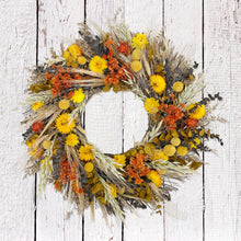 Load image into Gallery viewer, Santa Barbara Harvest Wreath featuring dried yellow daisy, wheat, and orange blooms on white wood