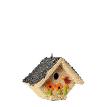 Load image into Gallery viewer, Decorative birdhouse covered in birdseed with dark roof and orange flowers