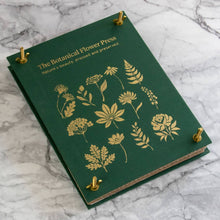 Load image into Gallery viewer, Green linen botanical flower press with gold foil plant illustrations and brass corner fasteners