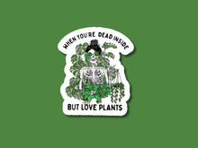 Load image into Gallery viewer, White die-cut sticker featuring skeleton surrounded by houseplants with humorous text about loving plants