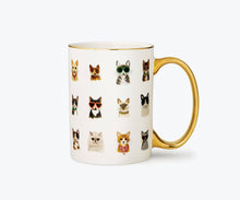 Load image into Gallery viewer, White porcelain mug with gold handle featuring colorful cat illustrations wearing accessories
