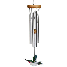 Load image into Gallery viewer, Wind chime with silver tubes, wooden top, and decorative hummingbird striker hanging below