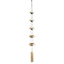 Load image into Gallery viewer, Brass wind chime with five graduated dome bells and wooden striker suspended vertically