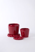 Load image into Gallery viewer, Glossy deep red ceramic Cinnamon Twist pot with braided rope-detail saucer and matching small pot