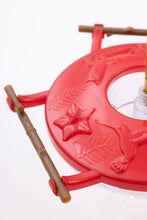 Load image into Gallery viewer, Red hummingbird feeder with wooden perches and decorative floral design, 8oz capacity