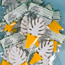 Load image into Gallery viewer, White leaf-shaped sticky traps with yellow tabs in clear packaging, multiple packs displayed