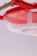 Load image into Gallery viewer, Red and clear plastic hummingbird feeder with 8oz capacity and feeding ports