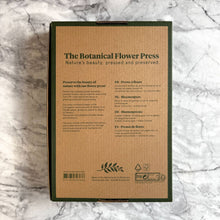 Load image into Gallery viewer, Botanical flower press kit with green linen cover on marble surface showing product details