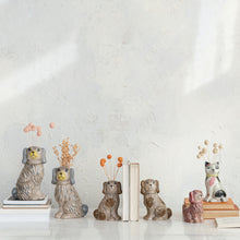 Load image into Gallery viewer, Collection of vintage ceramic dog planters and vases with decorative dried flowers on white surface