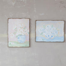 Load image into Gallery viewer, Two rustic canvas paintings of white and blue flowers in vases mounted on textured wall