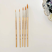 Load image into Gallery viewer, Set of five wooden watercolor paintbrushes with orange bristles arranged by size