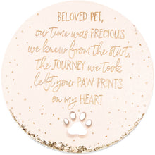 Load image into Gallery viewer, Round pink memorial garden stone with gold text about beloved pets and paw print design