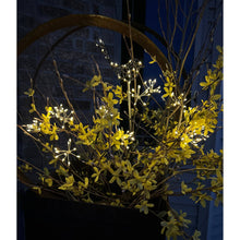 Load image into Gallery viewer, LED solar dandelion burst garden stakes with warm white lights illuminated among yellow foliage at dusk