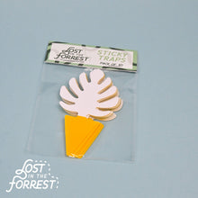 Load image into Gallery viewer, Pink leaf-shaped sticky traps with yellow bases in clear packaging from Lost in the Forrest