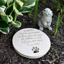 Load image into Gallery viewer, Beloved Pet memorial garden stone with paw print and rabbit statue in mulched garden bed