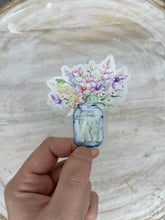Load image into Gallery viewer, Hand holding watercolor floral mason jar sticker with purple and pink flowers