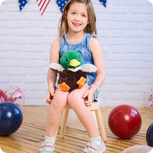 Load image into Gallery viewer, Young girl holding green and brown mallard duck plush toy while sitting on wooden stool