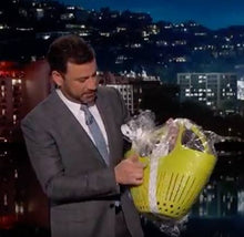 Load image into Gallery viewer, Yellow plastic garden colander with drainage holes being displayed on television show
