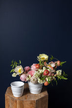 Load image into Gallery viewer, White ribbed ceramic pots on wooden surface with colorful spring flower arrangement