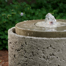Load image into Gallery viewer, Andros concrete fountain with textured stone finish and water spout in garden setting