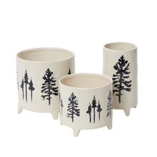 Load image into Gallery viewer, Set of three cream ceramic planters with black tree silhouette designs and legs