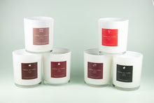 Load image into Gallery viewer, Six white soy candles in glass containers with colorful seasonal labels arranged in two rows
