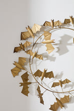 Load image into Gallery viewer, Gold metal bat wreath with flying bats arranged in a circular garland design